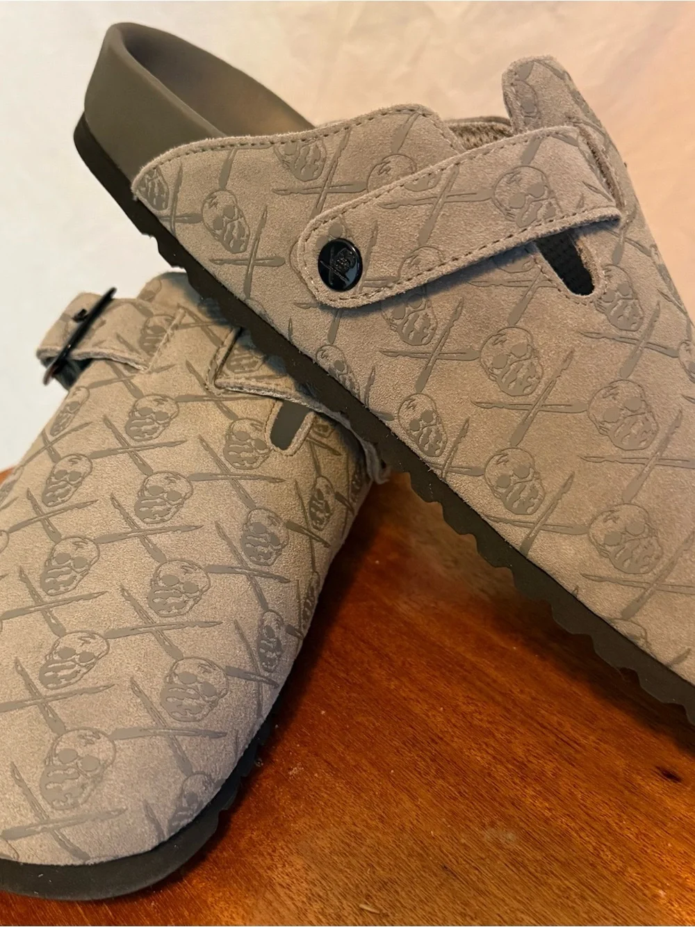 Men's SRGN mule in grey by The Surgeon with skull and crossbones pattern.